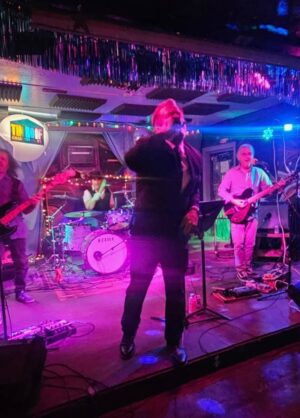 Photo of Only REM performing on a stage